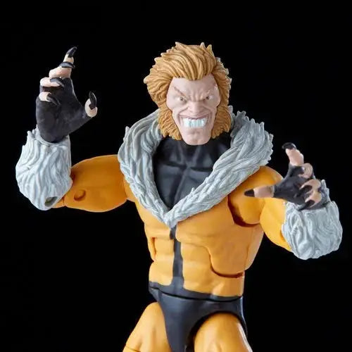 Marvel Legends Sabretooth Action Figure with man statue and fist