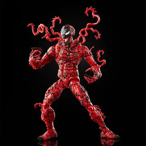 Close up of red Venom Carnage action figure on black background