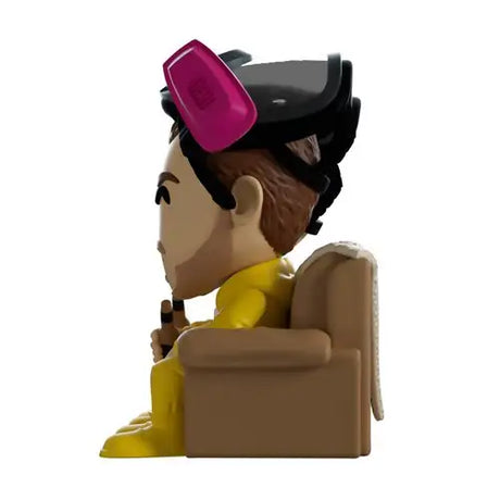 Jesse vinyl figure from Breaking Bad lounging on couch with pink hat