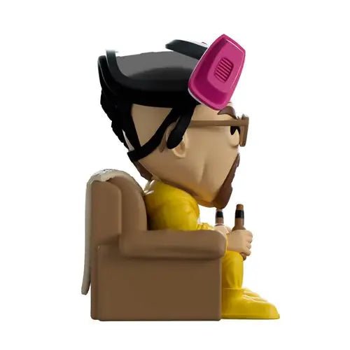 Breaking Bad Jesse Vinyl Figure with pink hair dryer sitting on couch