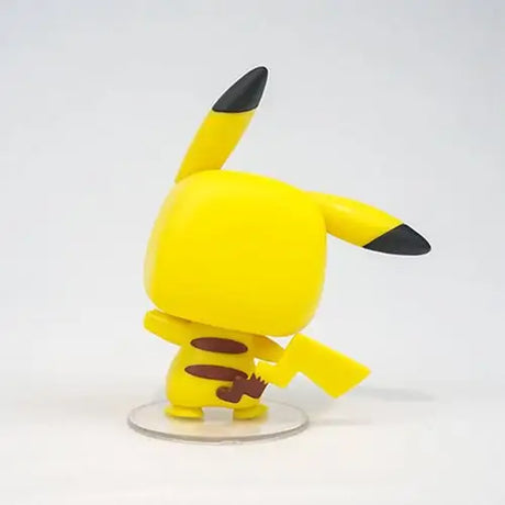 Yellow Pokemon Pikachu Funko Pop Figure standing on white surface