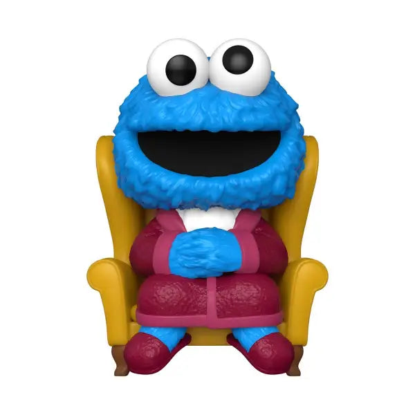 Smiling Cookie Monster Funko Pop in a yellow armchair from Sesame Street