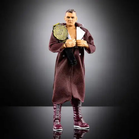 Action figure of WWE Ultimate Edition Gunther in maroon robe with championship belt