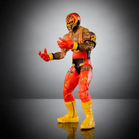 WWE Ultimate Edition Rey Mysterio Action Figure in red and yellow attire with mask