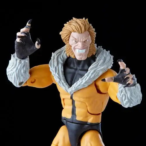 Marvel Legends Sabretooth Action Figure with man statue and fist