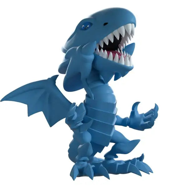 Cartoon-style Blue Eyes White Dragon figurine with sharp teeth and claws from production run