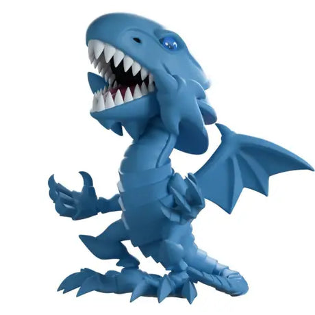 Cartoon-style Blue-Eyes White Dragon figurine with sharp teeth and claws from production run