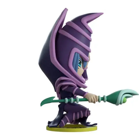 Cartoon figurine of Dark Magician wielding green blade from production run vinyl figure